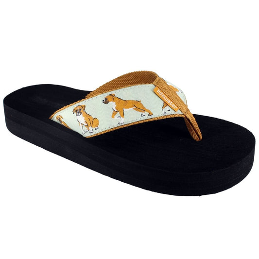 Black sandal with a tan strap featuring dog illustrations on a white background