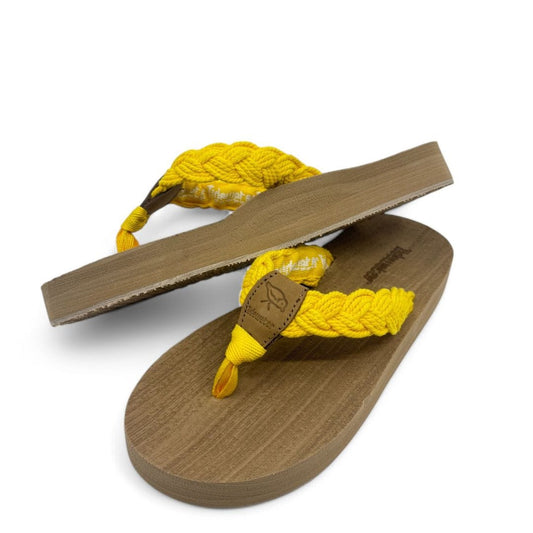 Bright yellow flip-flops with braided straps and a textured brown sole, perfect for summer outings and beach days.