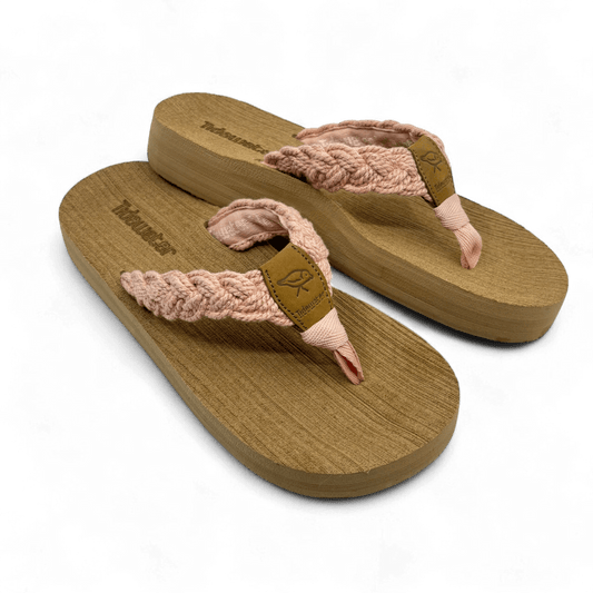 Pair of flip flops with tan comfort footbed and blush-pink braided straps featuring soft shimmer and leather accent tag

